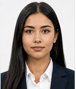 A person photographed against a plain light wall, ready to upload
