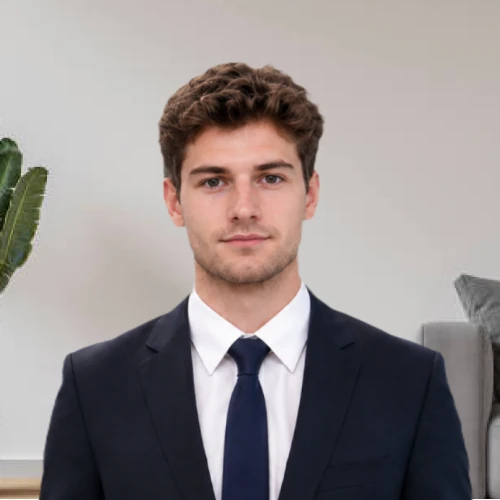 A person photographed at home against a plain wall, ready to upload